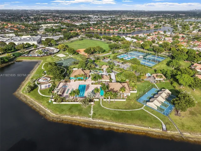an aerial view of residential houses with outdoor space