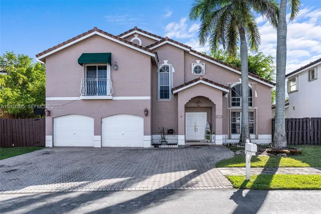 an aerial view of lake and residential houses with outdoor space