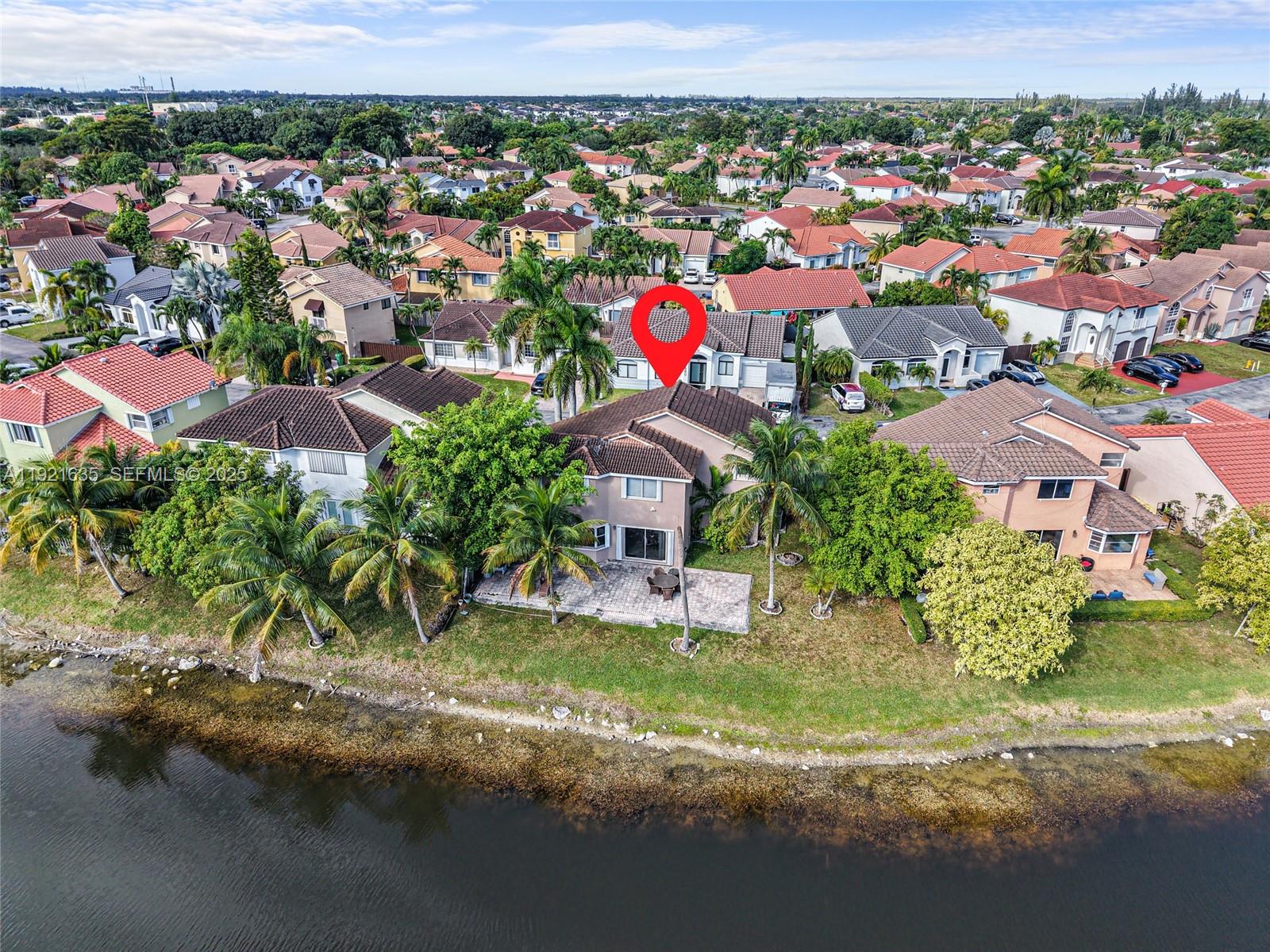 4687 Southwest 153rd Court Miami, FL 33185 - Photo 6 of 40 an aerial view of residential houses with outdoor space and trees