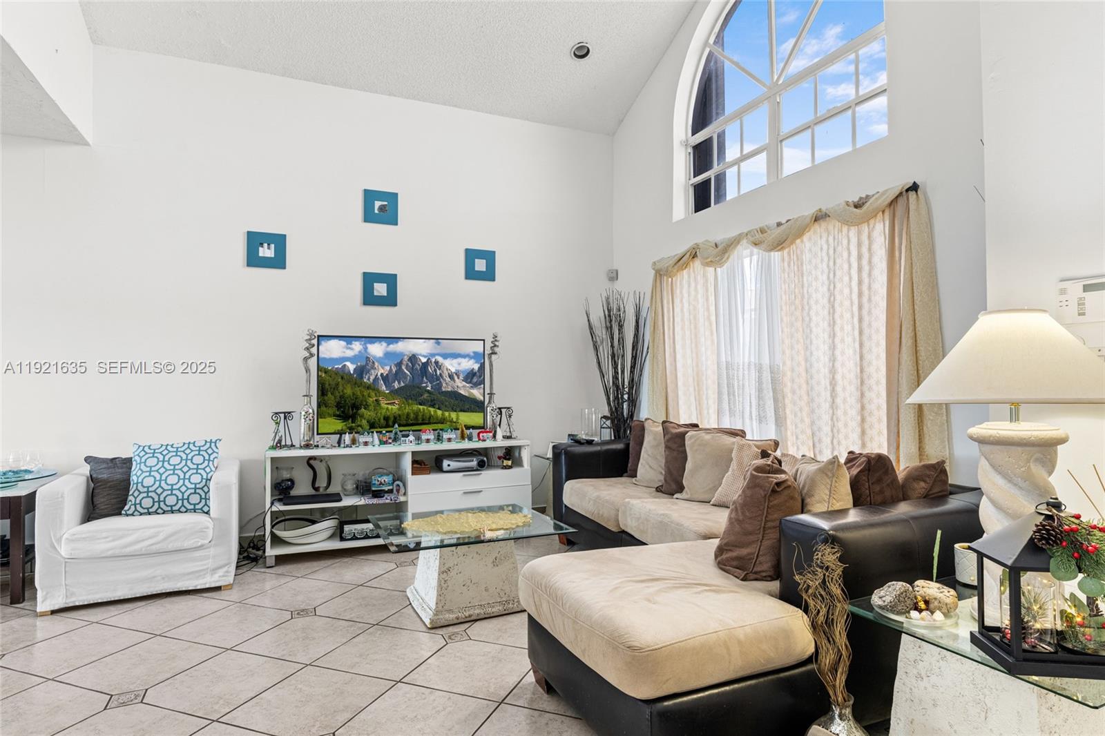 4687 Southwest 153rd Court Miami, FL 33185 - Photo 9 of 40 a living room with furniture and a flat screen tv