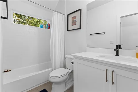 a bathroom with a sink a toilet and a bathtub
