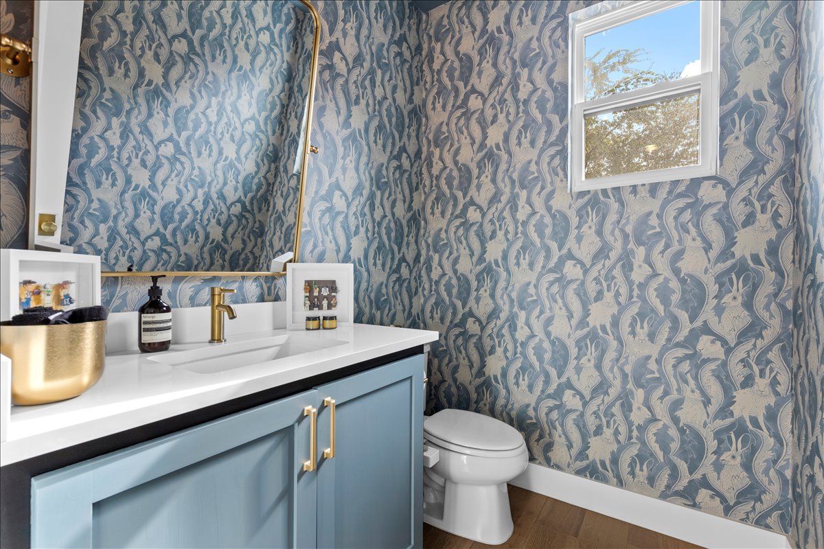 4201 Clawson Road Austin, TX 78704 - Photo 21 of 25 a bathroom with a granite countertop sink and a toilet
