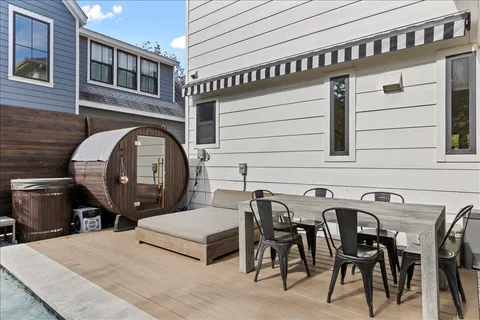 a view of a dinning table and chairs in patio