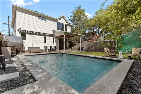 swimming pool view with a outdoor seating