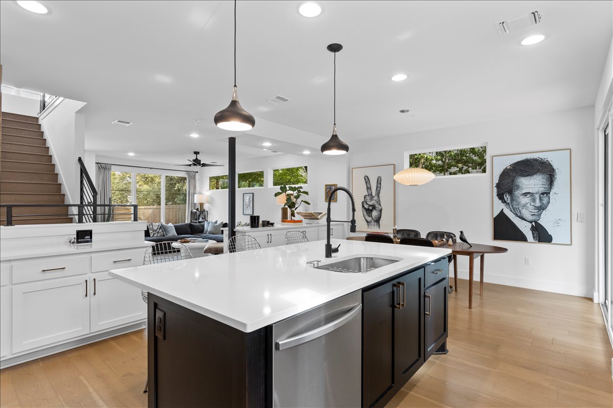 4201 Clawson Road Austin, TX 78704 - Photo 8 of 25 a kitchen with a sink a counter and chairs