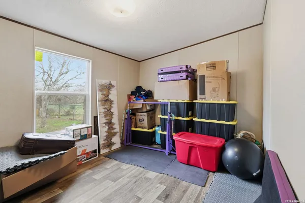 a bedroom with furniture and a window