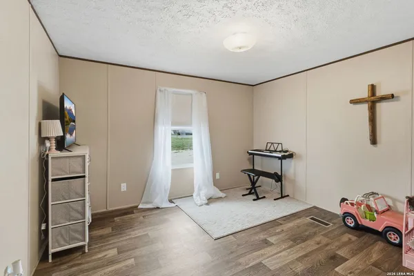 a bedroom with furniture and a window