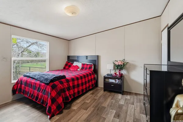 a bedroom with a bed and window