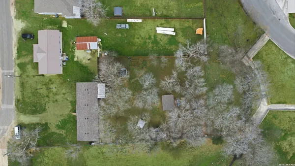 an aerial view of residential house with outdoor space