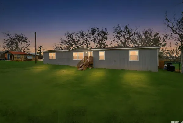 an aerial view of a house with a garden