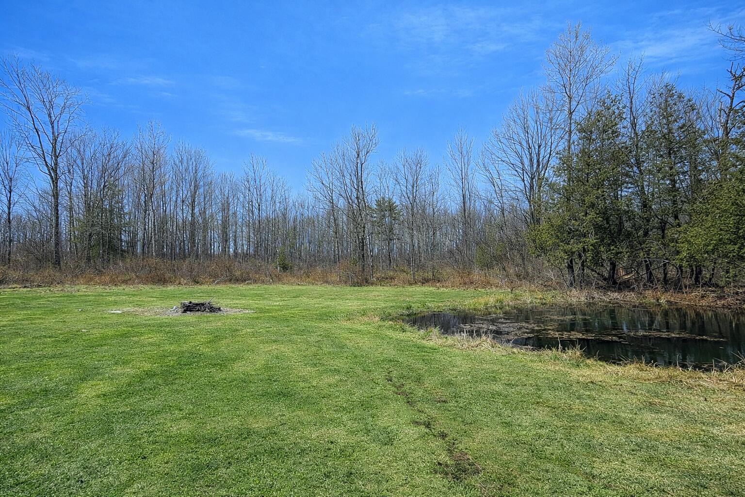 168 Corinth Road Garland, ME 04939 - Photo 3 of 26 Tranquil pond and forest clearing