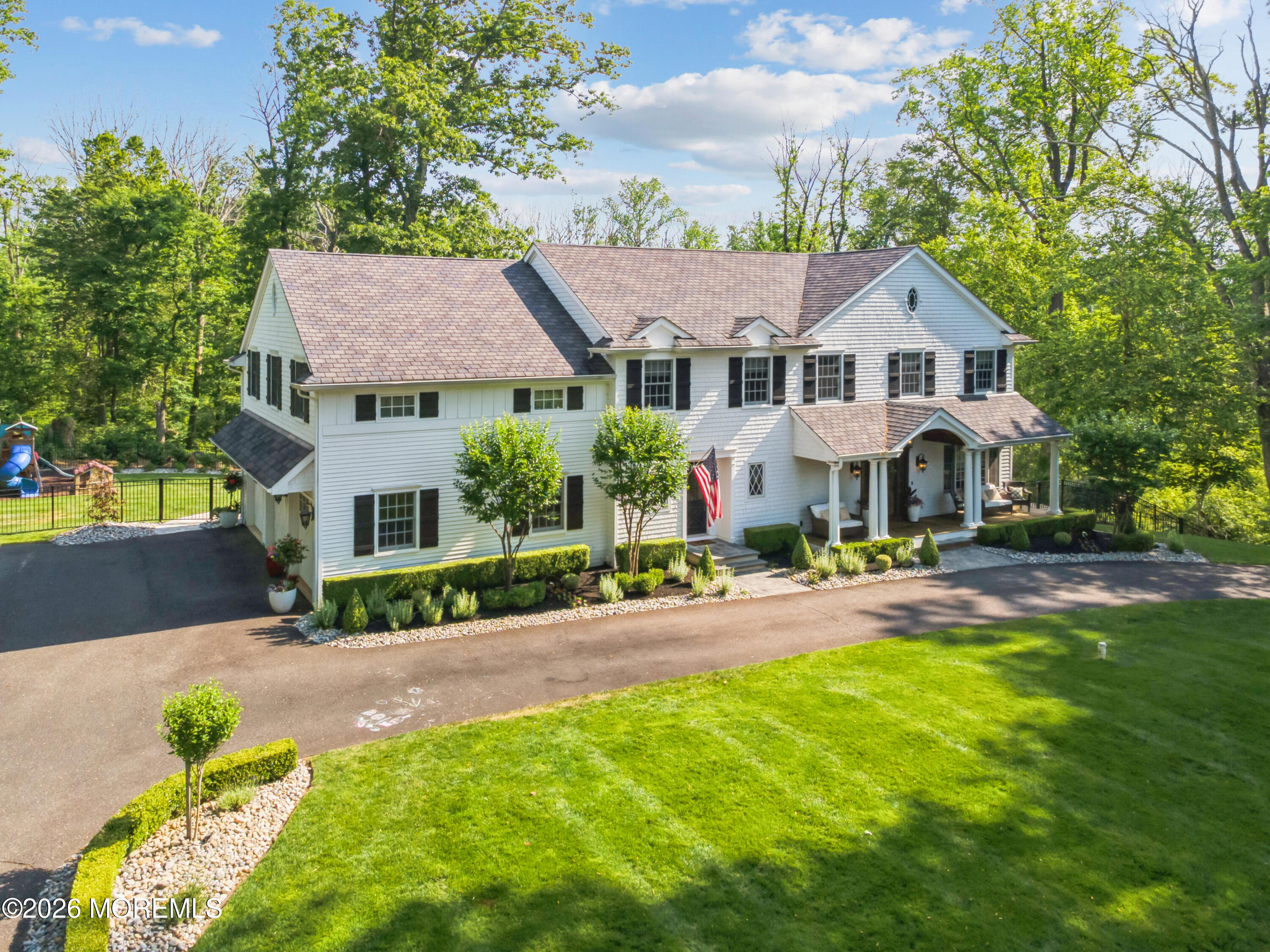 92 Tulip Lane Colts Neck, NJ 07722 - Photo 48 of 55 a front view of a house with yard and green space