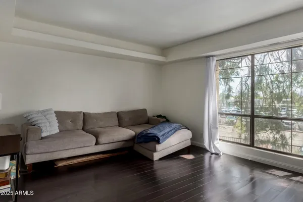 a living room with furniture and a large window