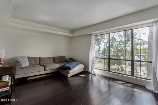 a living room with furniture and a large window