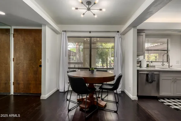a view of a dining room with furniture window and wooden floor