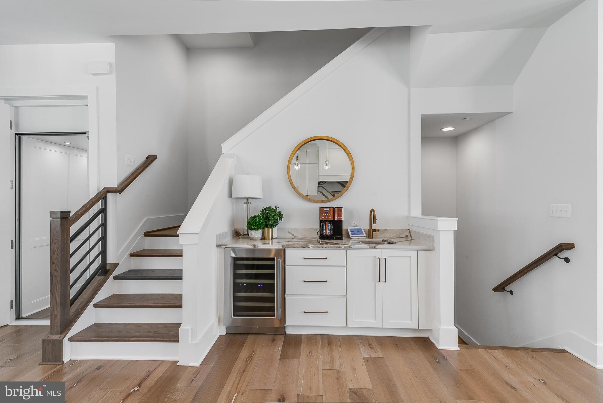8201 River Road Bethesda, MD 20817 - Photo 17 of 50 a view of a hallway with entryway wooden floor and front door