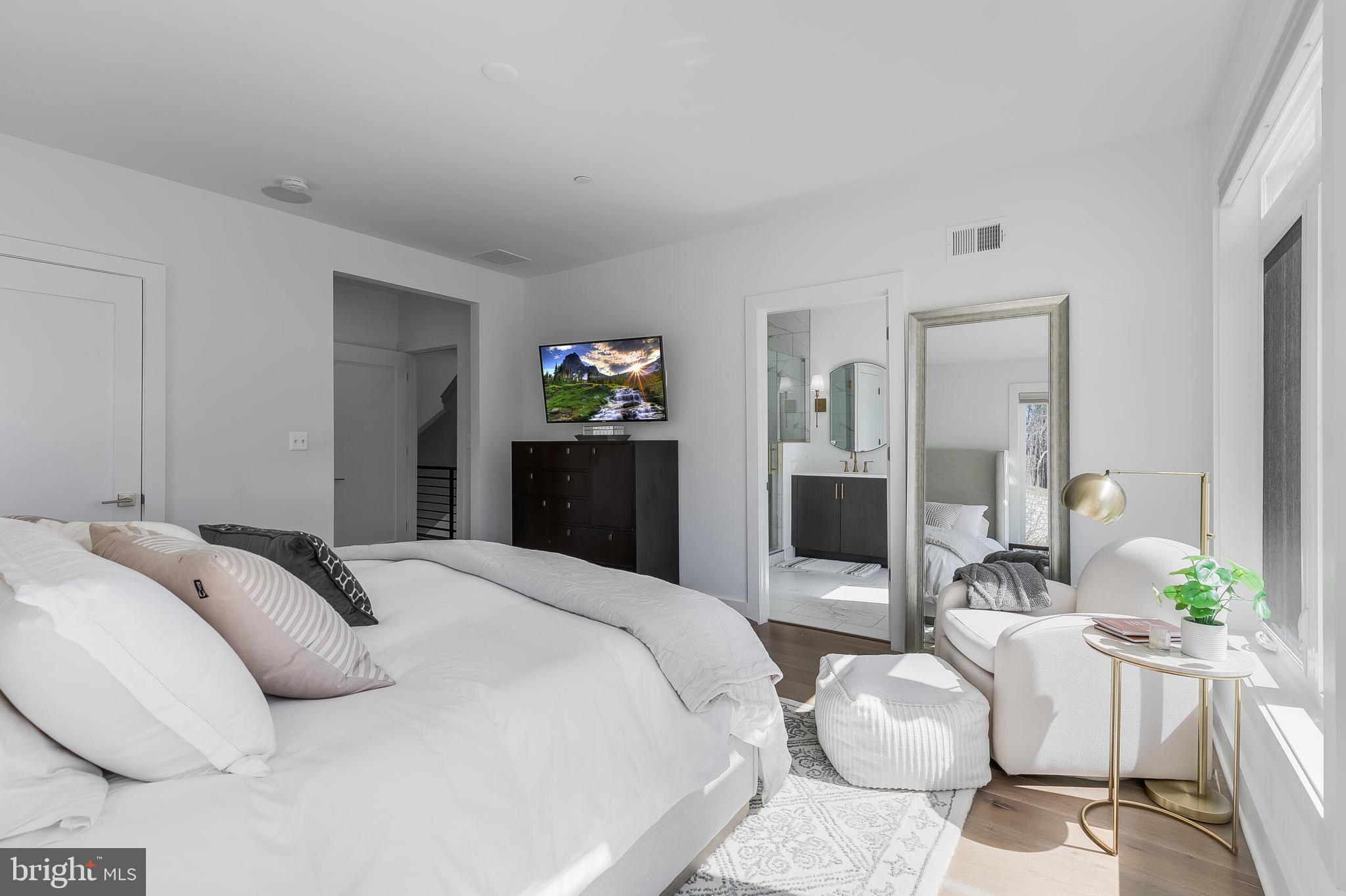 8201 River Road Bethesda, MD 20817 - Photo 19 of 50 a bedroom with a bed and glass windows