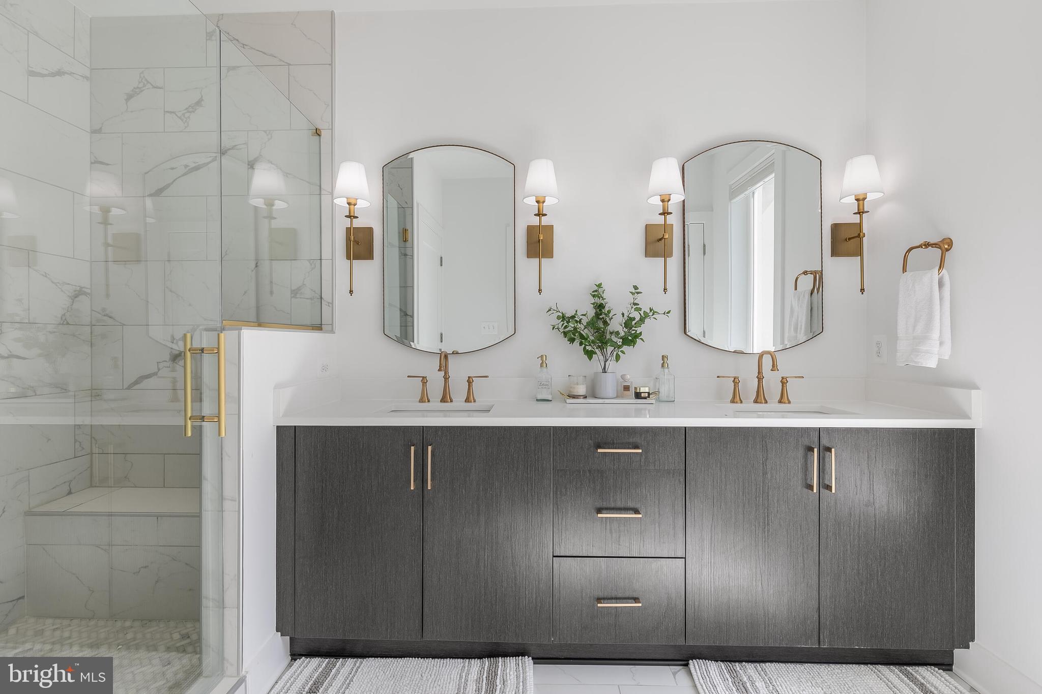 8201 River Road Bethesda, MD 20817 - Photo 20 of 50 a bathroom with a double vanity sink and a mirror