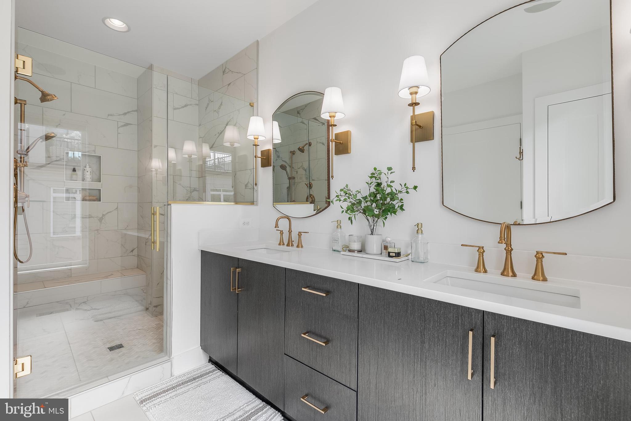 8201 River Road Bethesda, MD 20817 - Photo 21 of 50 a bathroom with a double vanity sink mirror and shower