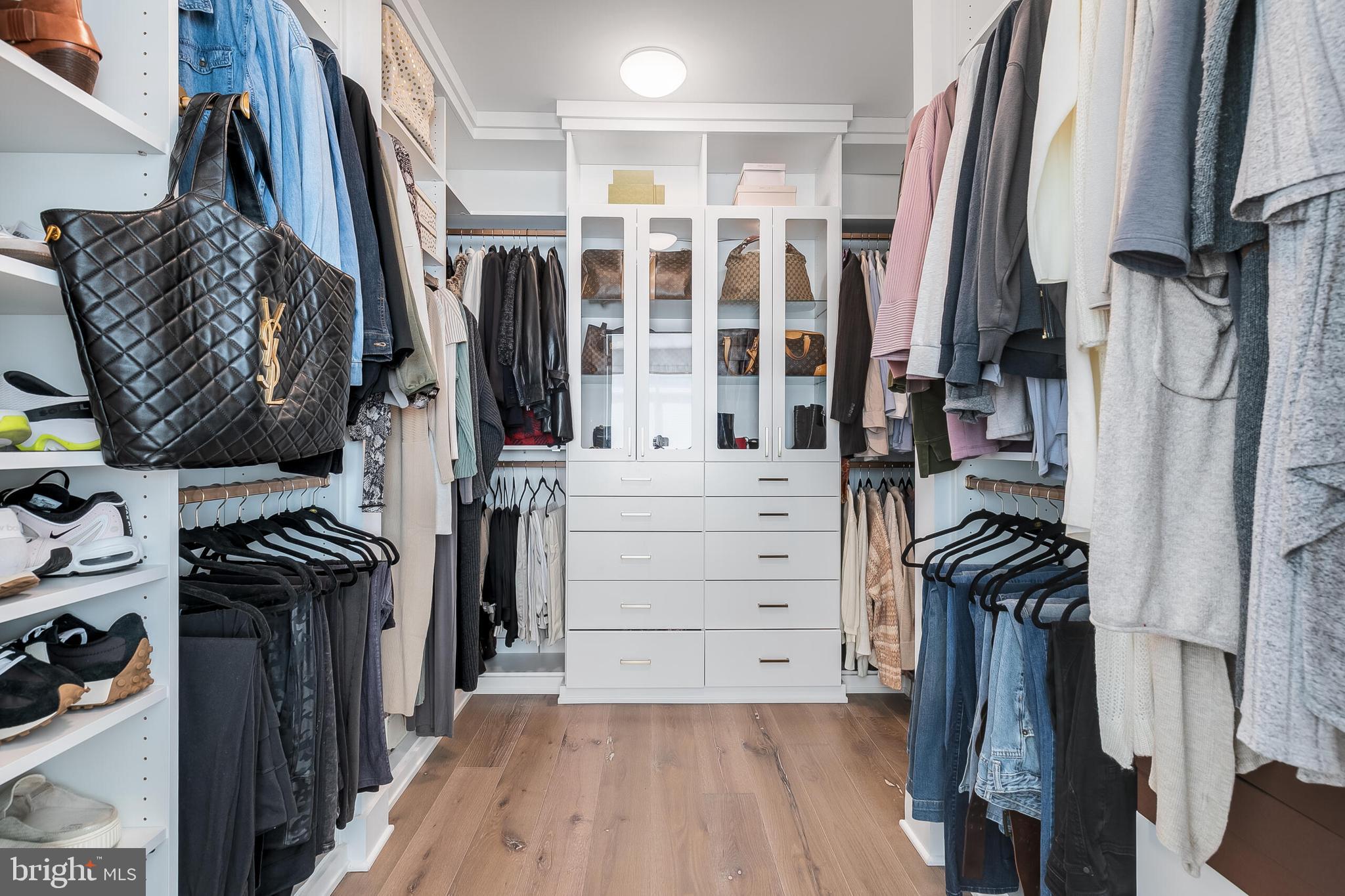 8201 River Road Bethesda, MD 20817 - Photo 22 of 50 a view of walk in closet with clothes