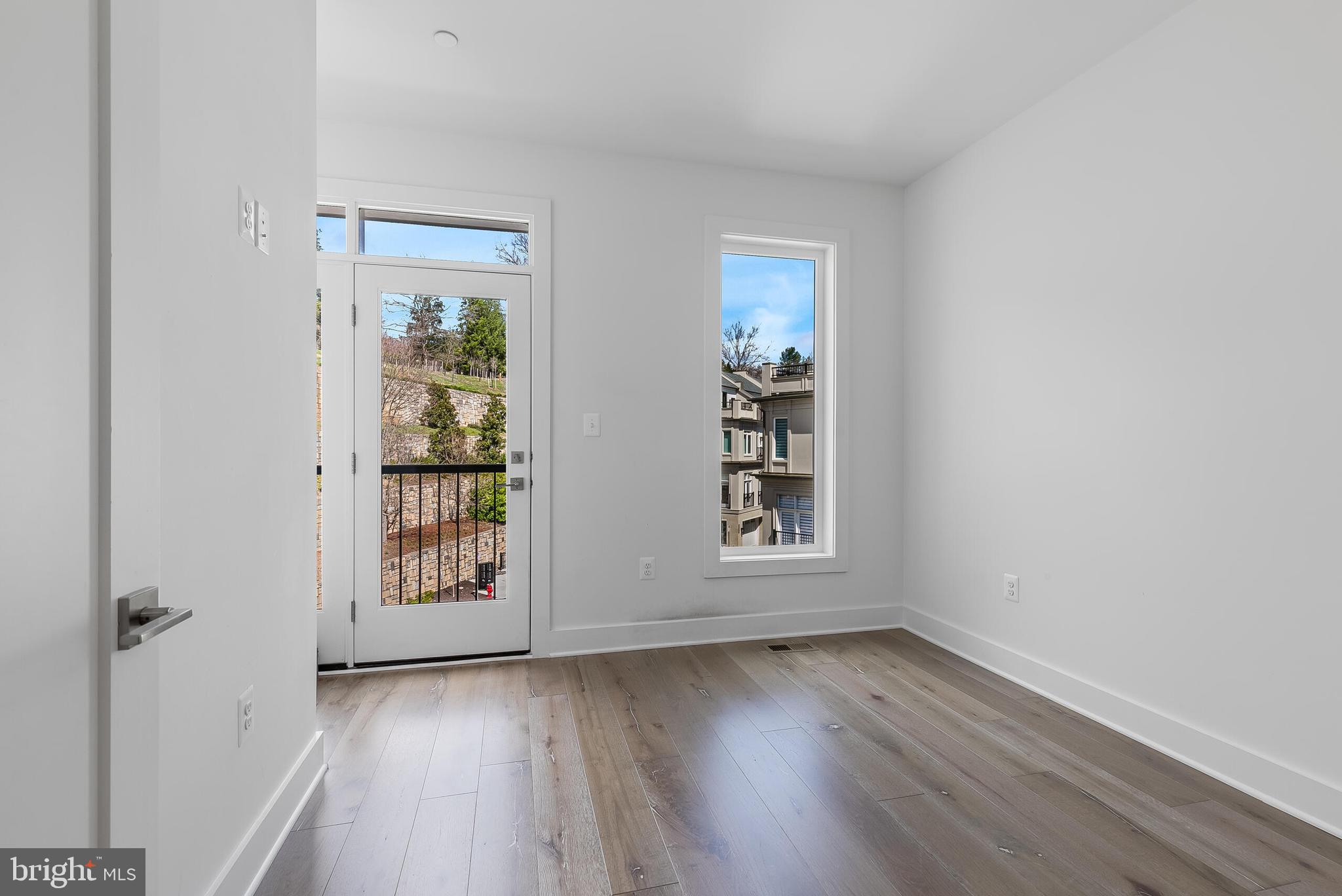 8201 River Road Bethesda, MD 20817 - Photo 25 of 50 an empty room with wooden floor and windows