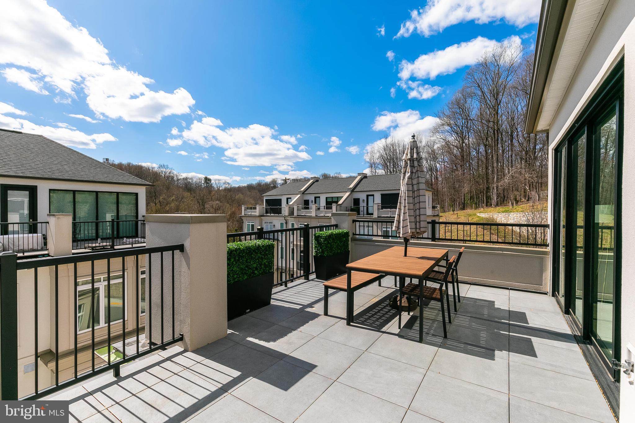 8201 River Road Bethesda, MD 20817 - Photo 32 of 50 a view of a patio with a table and chairs