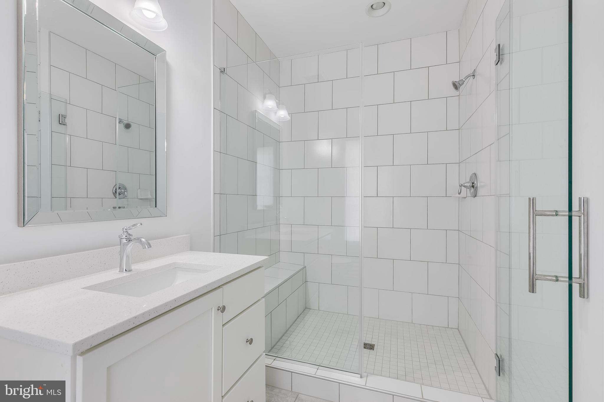 8201 River Road Bethesda, MD 20817 - Photo 35 of 50 a bathroom with a shower toilet and sink