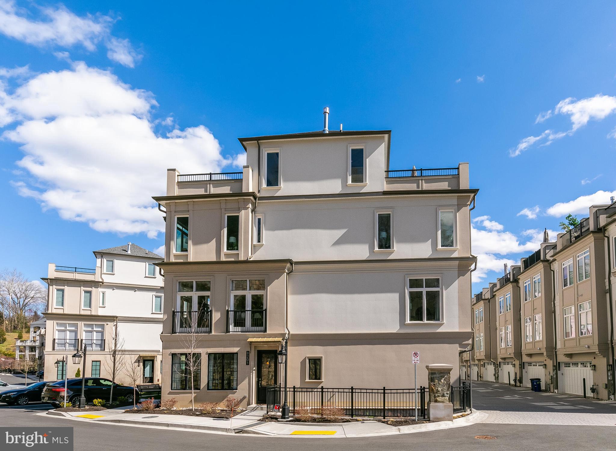 8201 River Road Bethesda, MD 20817 - Photo 4 of 50 a front view of a building with lot of cars and trees