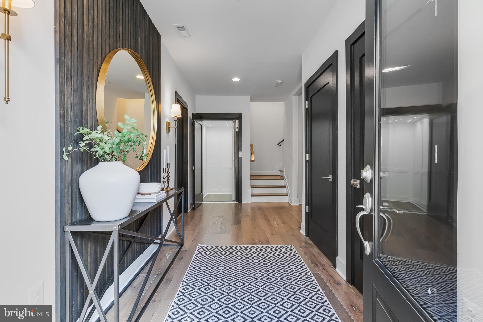 8201 River Road Bethesda, MD 20817 - Photo 5 of 50 a view of a hallway with furniture and wooden floor