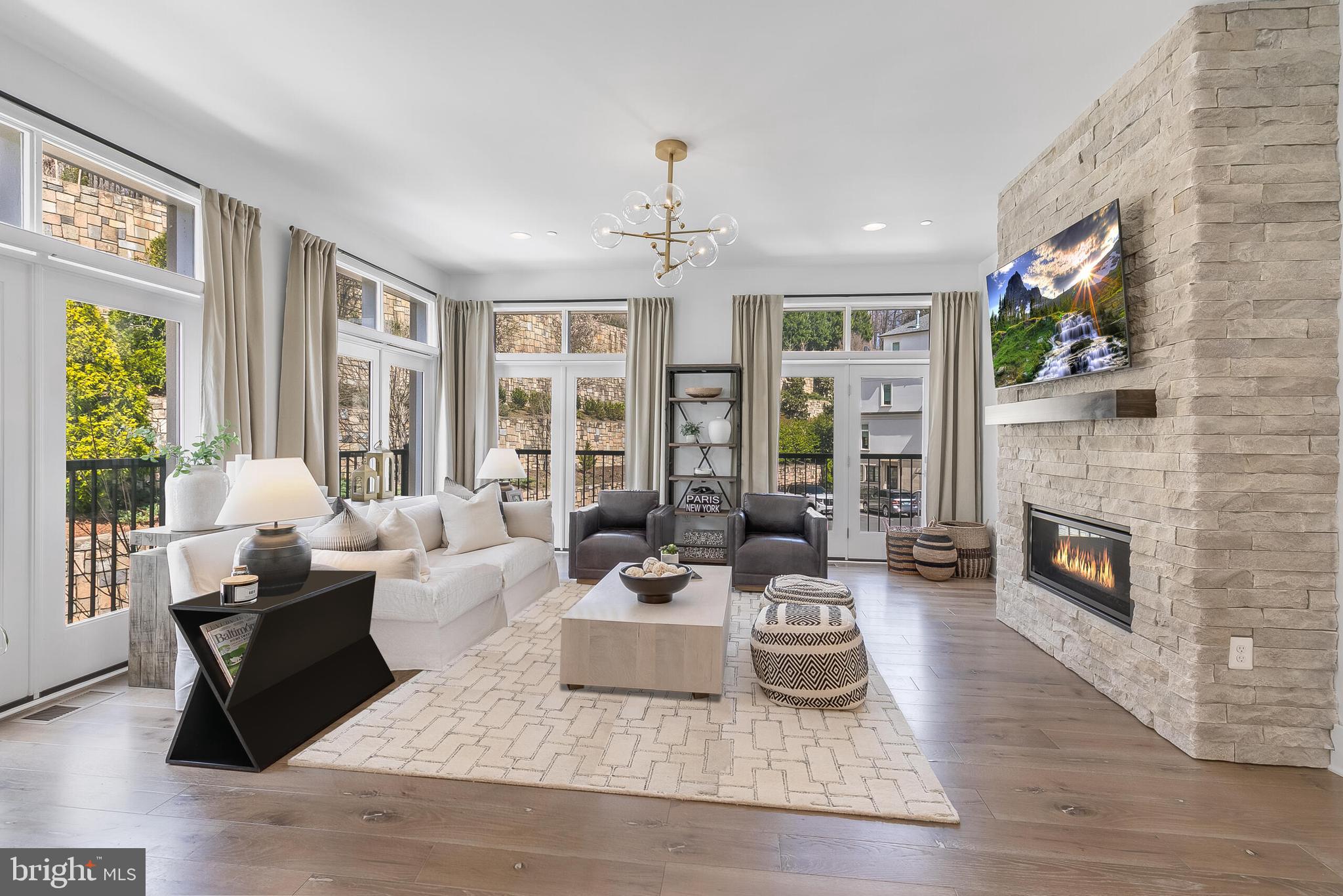 8201 River Road Bethesda, MD 20817 - Photo 7 of 50 a living room with furniture fireplace and large windows