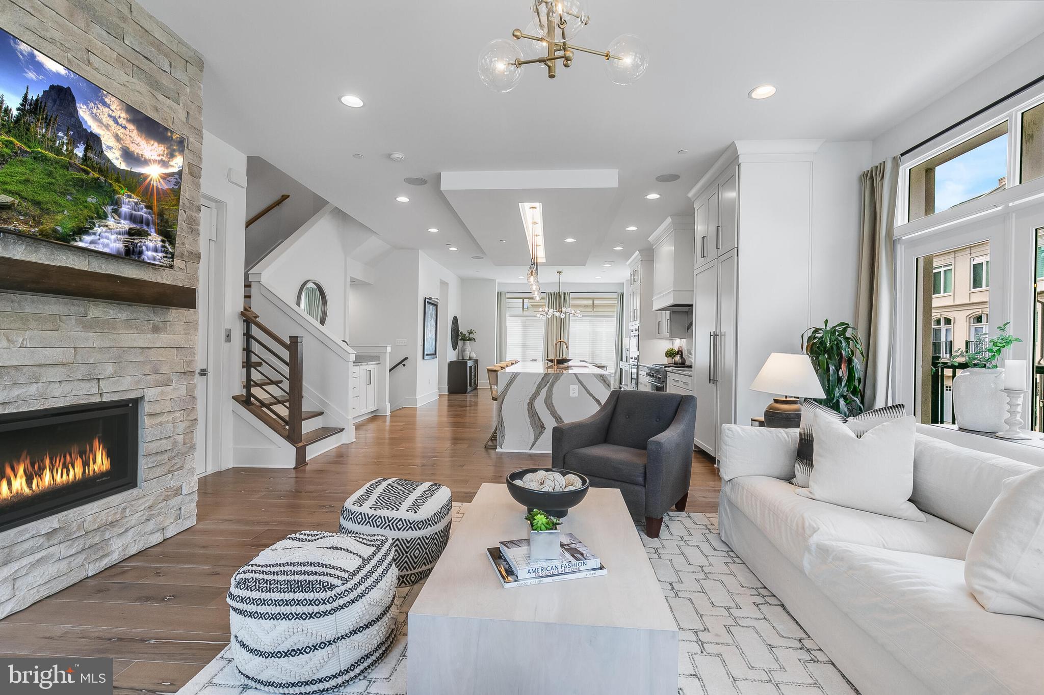 8201 River Road Bethesda, MD 20817 - Photo 8 of 50 a living room with furniture and a fireplace