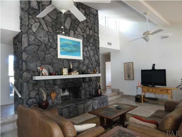 5573 Ponte Verde Road Pensacola, FL 32507 - Photo 12 of 24 The east wall with striking stone fireplace