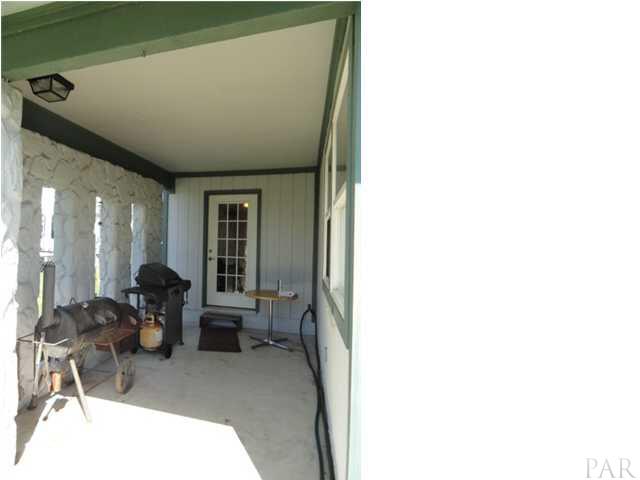 5573 Ponte Verde Road Pensacola, FL 32507 - Photo 13 of 24 The covered barbeque area off the breakfast room