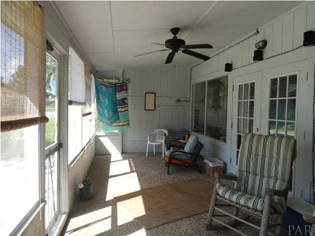 5573 Ponte Verde Road Pensacola, FL 32507 - Photo 14 of 24 The large screened porch on the waterfront side of the house