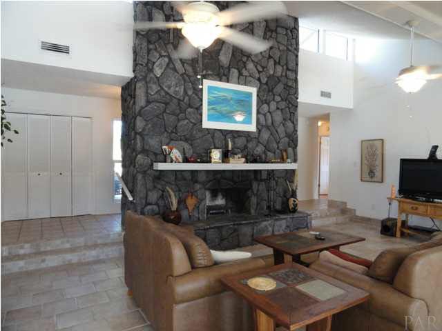 5573 Ponte Verde Road Pensacola, FL 32507 - Photo 20 of 24 Sunlight floods the room in the mornings from the clerestory windows above the fireplace
