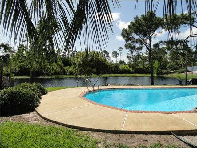 5573 Ponte Verde Road Pensacola, FL 32507 - Photo 2 of 24 The pool overlooks the lake