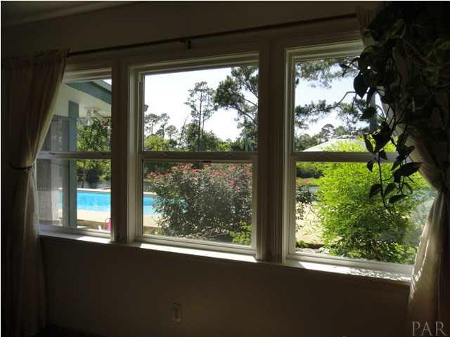 5573 Ponte Verde Road Pensacola, FL 32507 - Photo 9 of 24 Windows in the dining room overlook the backyard oasis