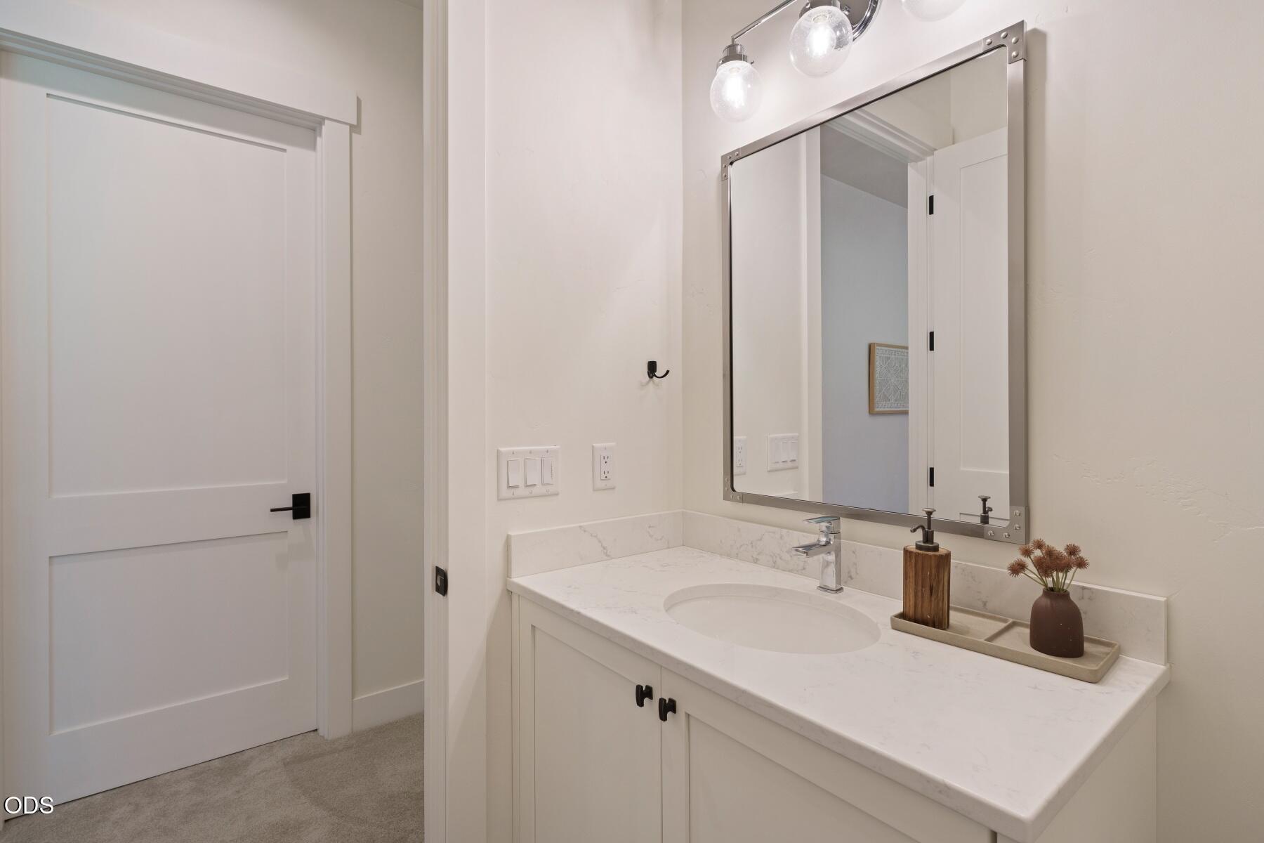 60255 Sunset View Drive Bend, OR 97702 - Photo 34 of 48 a bathroom with a sink and a mirror