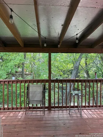 a balcony with wooden floor
