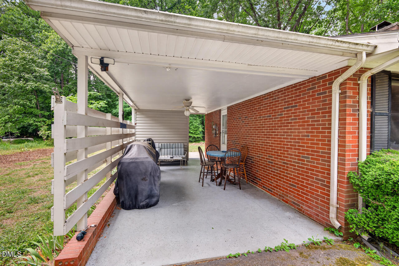 1420 Goodwin Road Durham, NC 27712 - Photo 35 of 54 a view of a patio with table and chairs and potted plants