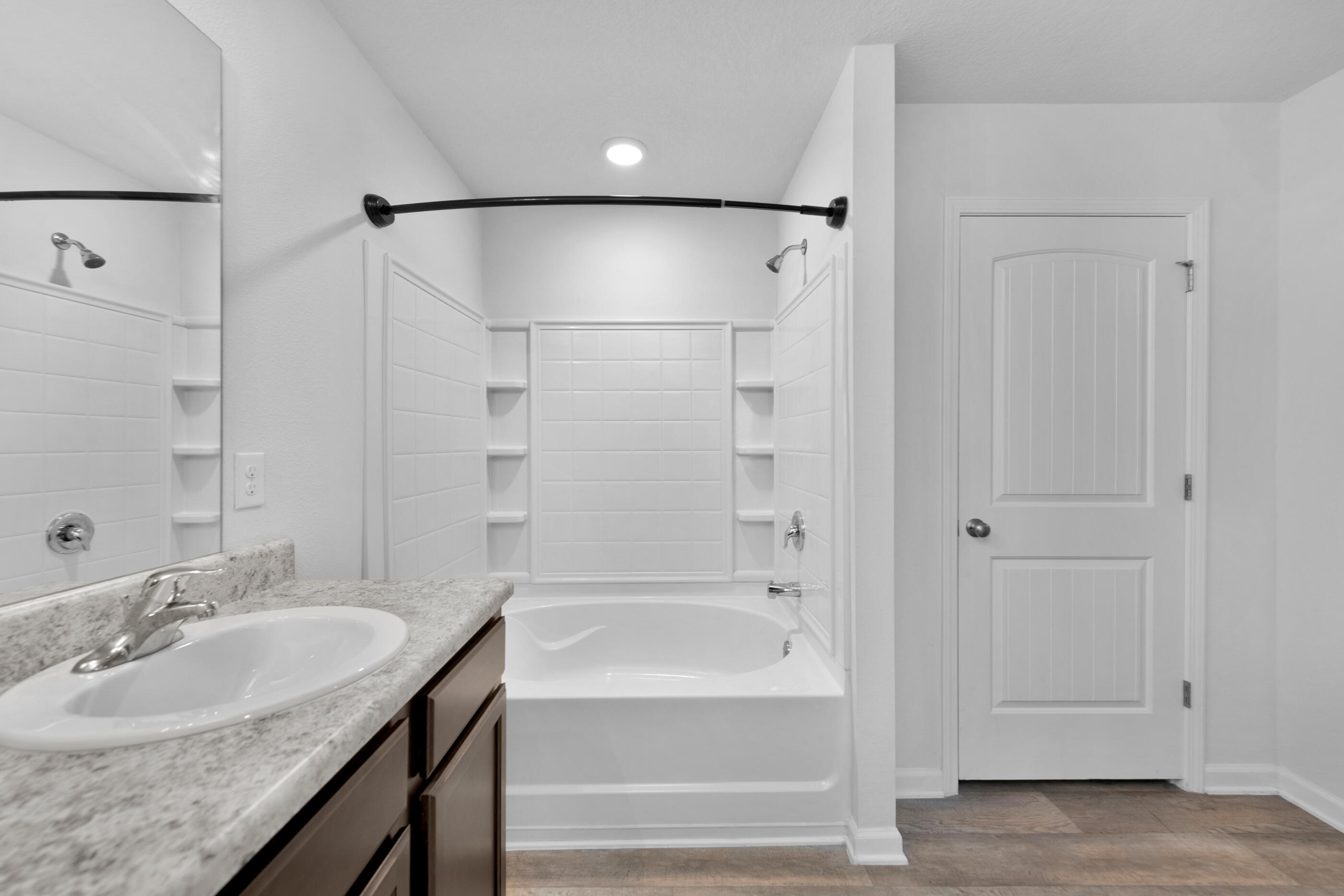 812 Moorhen Way Crestview, FL 32539 - Photo 15 of 22 a bathroom with a granite countertop sink mirror bathtub and shower