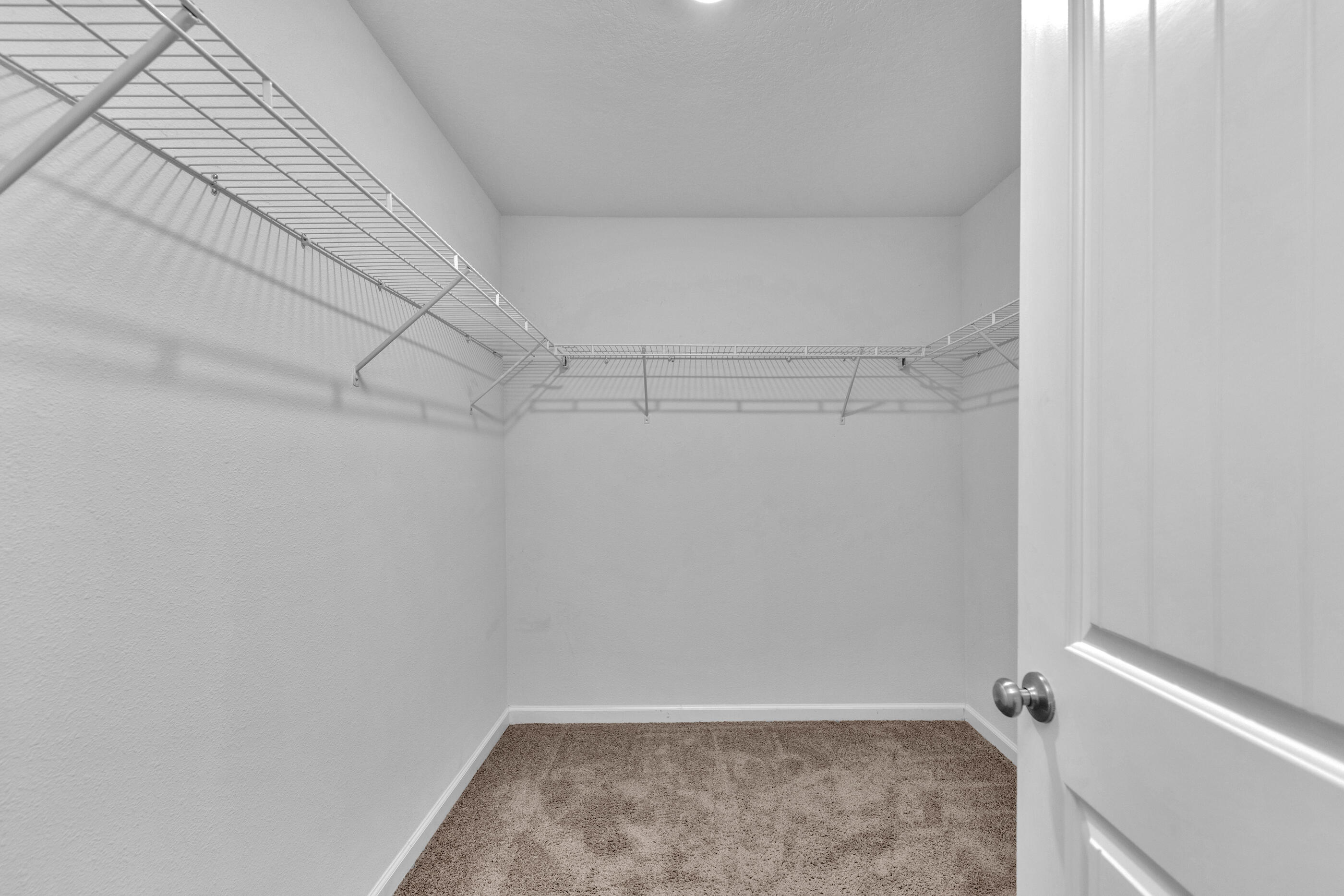 812 Moorhen Way Crestview, FL 32539 - Photo 16 of 22 a view of a room with racks on the wall