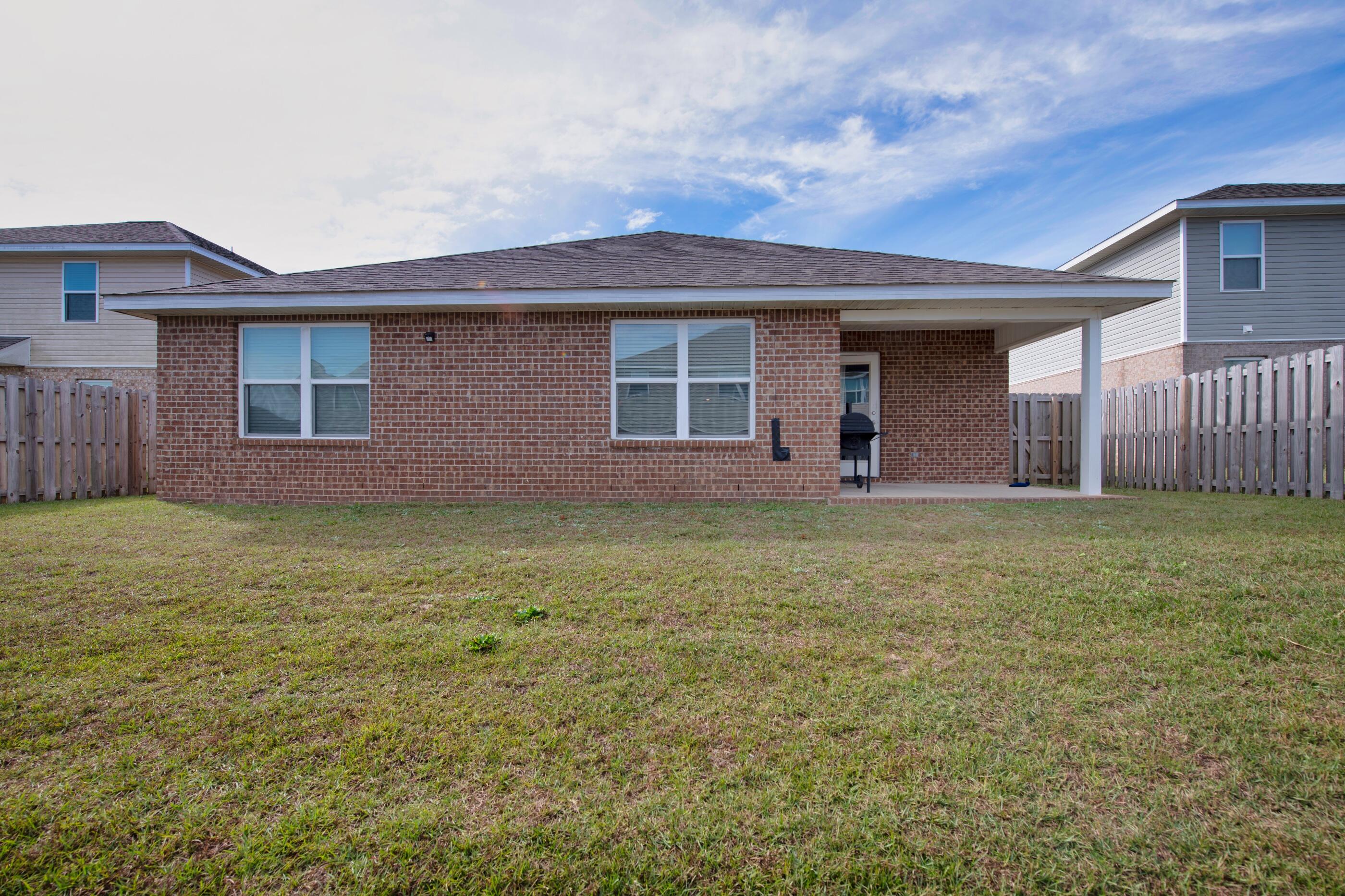 812 Moorhen Way Crestview, FL 32539 - Photo 22 of 22 a front view of a house with garden