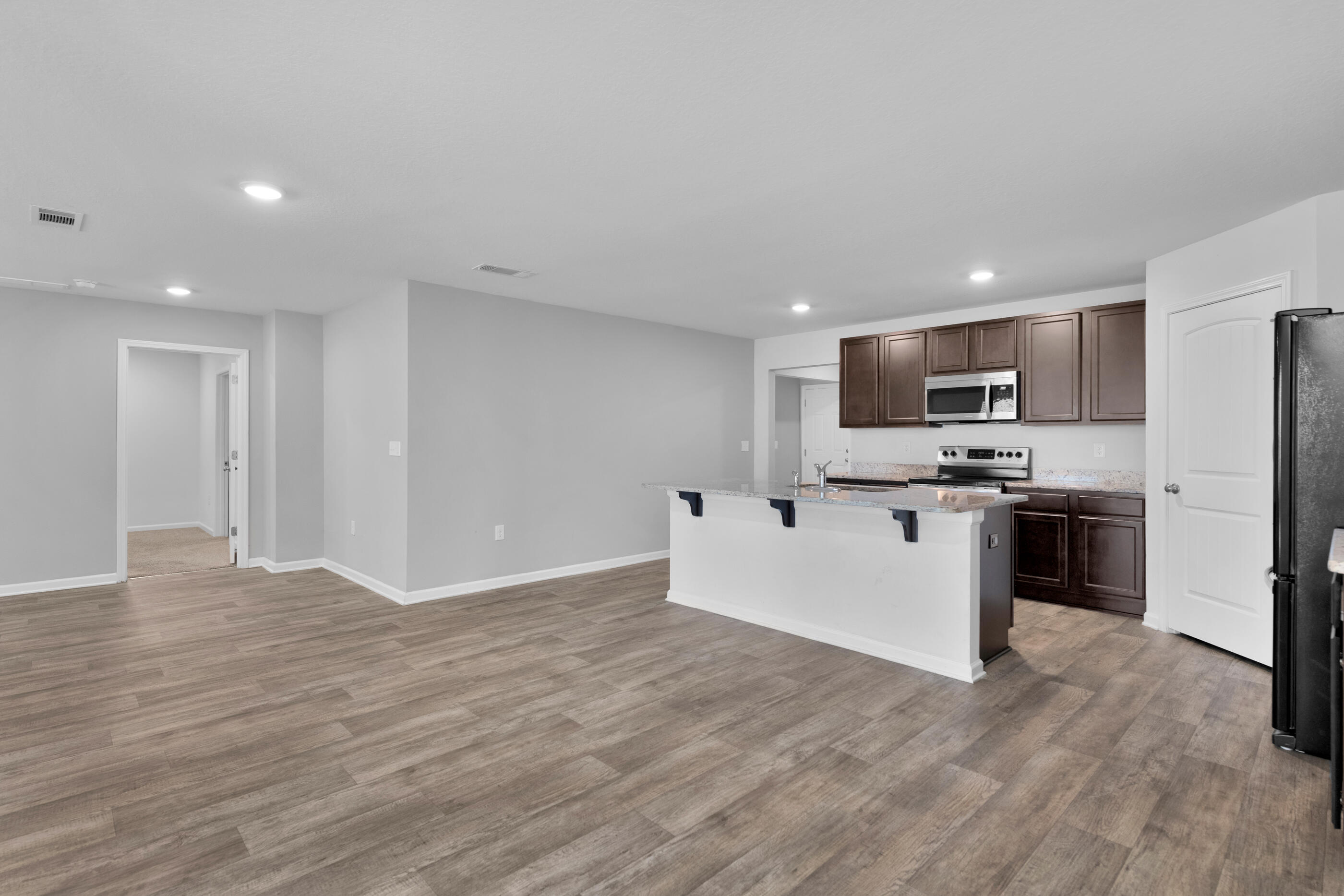 812 Moorhen Way Crestview, FL 32539 - Photo 7 of 22 a view of kitchen with granite countertop stainless steel appliances and sink