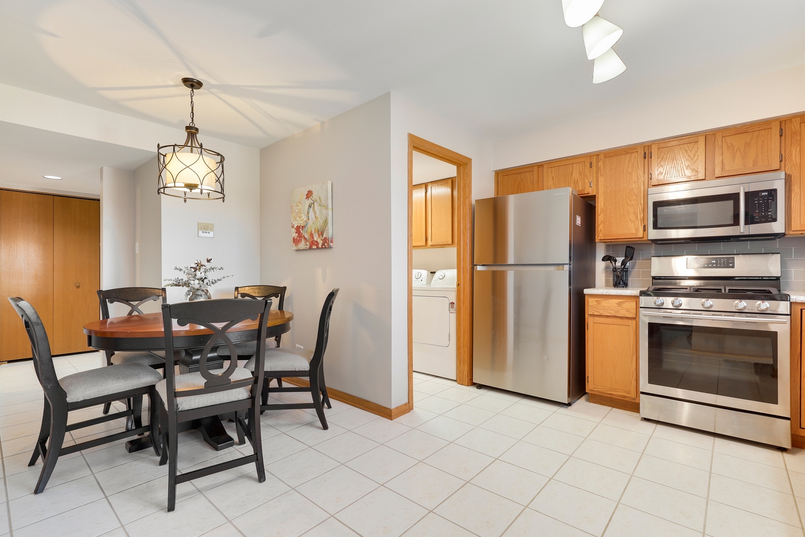 18206 Rita Road, Unit 2A Tinley Park, IL 60477 - Photo 9 of 22 a view of a dining room with furniture window and kitchen view