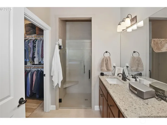 a bathroom with a sink vanity and a mirror