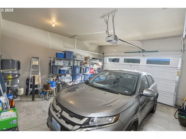 a living room with lots of furniture and a chandelier