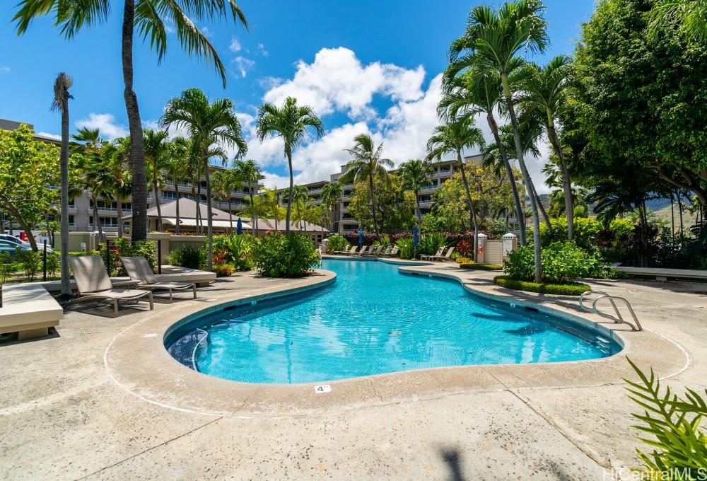 1 Keahole Place, Unit 3512 Honolulu, HI 96825 - Photo 12 of 18 a view of a swimming pool with outdoor seating