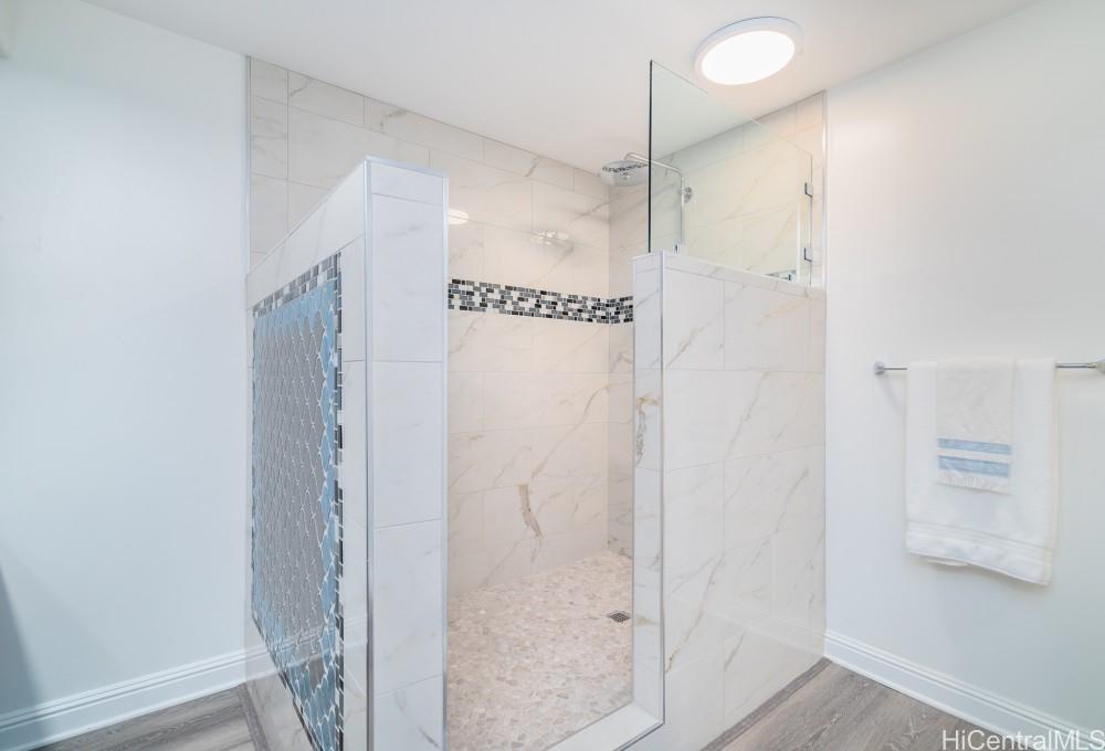 1 Keahole Place, Unit 3512 Honolulu, HI 96825 - Photo 14 of 18 a bathroom with a shower and a glass door