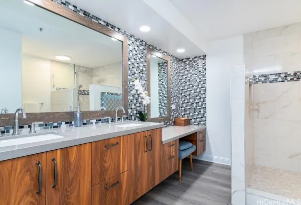 a bathroom with a double vanity sink mirror and double